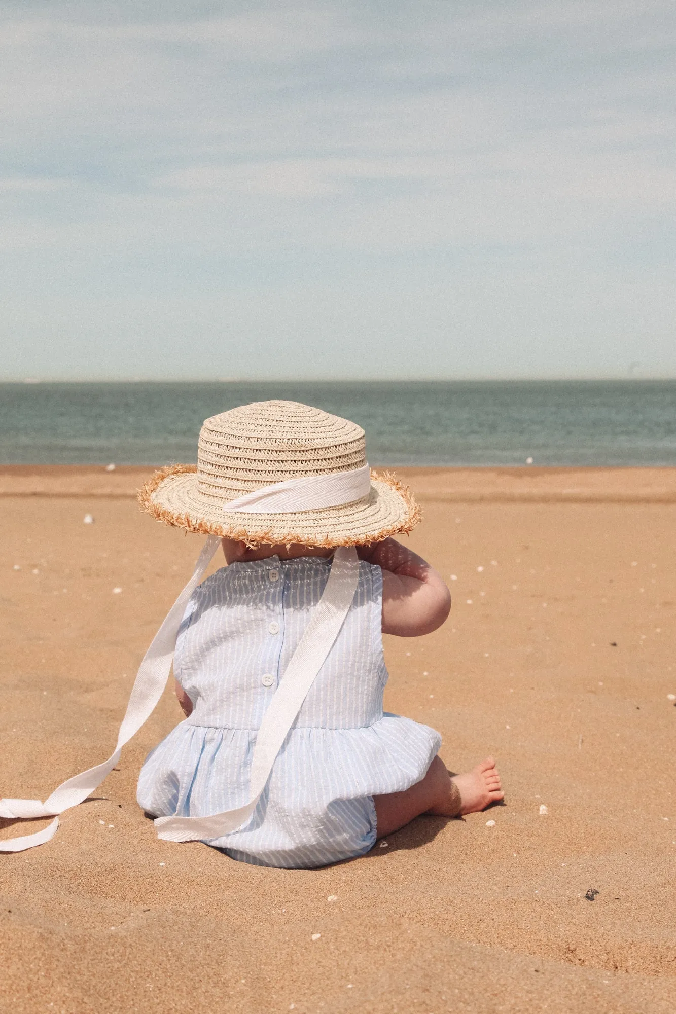 Straw Hat With White Cotton Ties